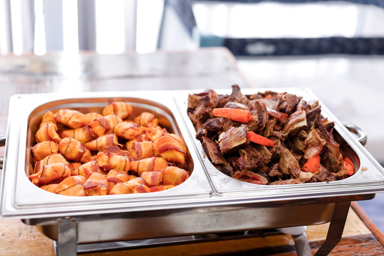 Delicious buffet with bacon wrapped potatoes and roast beef, perfect for any meal.